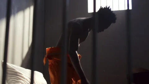 Inmate Throwing Papers and Pillow in Emotional Outburst in Prison Cell Stock Footage 311608909