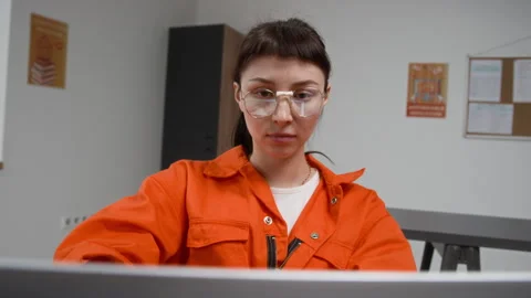 Inmate Using Laptop and Looking at Screen during Computer Class in Prison Stock Footage 328997535