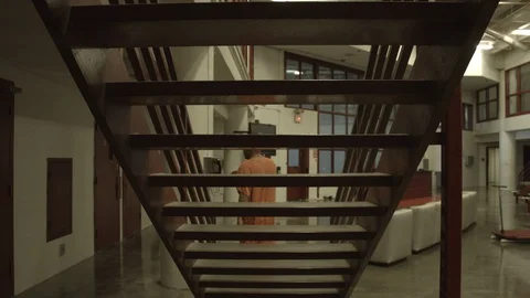 Inmate Walking Down the Stairs Stock Footage 88411419
