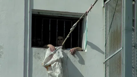 Inmates Looking through Barred Window at Olmos Maximum Security Prison, 4K Stock Footage 332243091