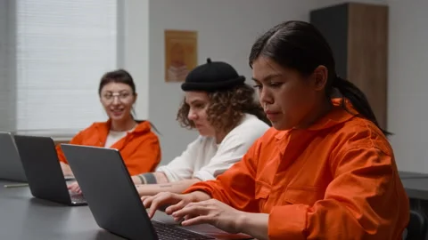 Inmates Using Laptops during Class in Prison Hispanic Woman Typing Stock Footage 328998923