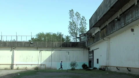 Inmates Walking in Yard of an Old Prison in Buenos Aires Province, Argentina. Stock Footage 201643727