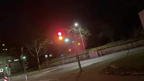 Inner city traffic light at night Stock Footage 159064671
