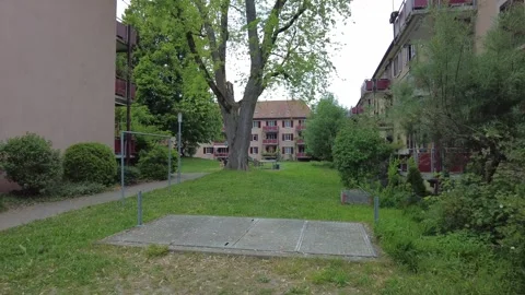 Inner courtyard of residential apartment complex with green lawn in Zurich Stock Footage 334632999