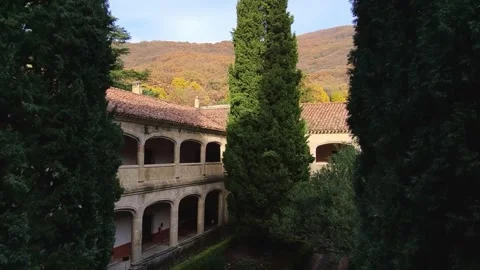 Inner courtyard of the Yuste Monastery cloister. Stone arches on two levels, a Stock Footage 341528764