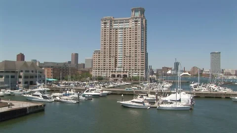 Inner Harbor with commercial buildings in background in Baltimore, Maryland USA Stock Footage 105487552