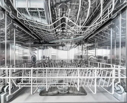 Inner space of dishwasher machine. Stock Photos