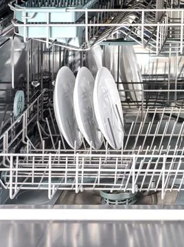 Inner space of dishwasher machine. Stock Photos