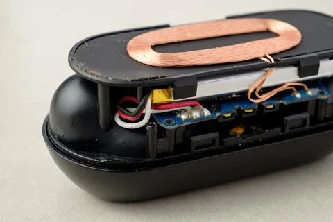 Inner workings of a modern wireless charging device in close view Stock Photos