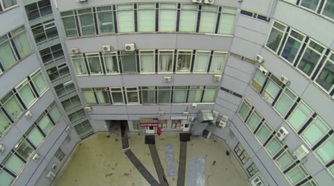 Inner yard of pentagon shaped building with windows of offices Stock Footage 37343493