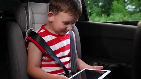 Innocent face of a child, Summer trip with family, Easy car ride, Tablet for Stock Footage 313204974