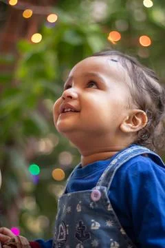 Innocent toddler cute facial expression at day from flat angle Фото