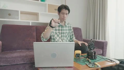 Innovating Technology: A Man Working on Electronics at Home Stock Footage 319415127