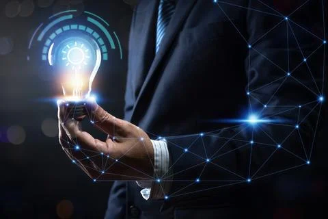 Innovation and energy of creative thinking, businessman holding light light.. Stock Photos