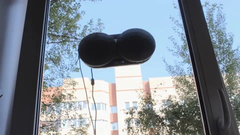 Innovation in household help - wash machine for windows, interior shot Stock-Footage 204954792