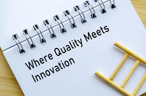 Innovation Made Real text on notebook with miniature ladder symbolizing pro.. Stock Photos