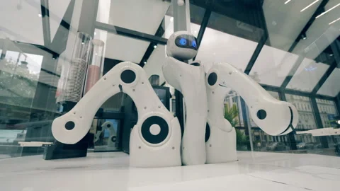 Innovation, modern technology concept. Robot is moving its arms in a coffee shop Stock Footage
