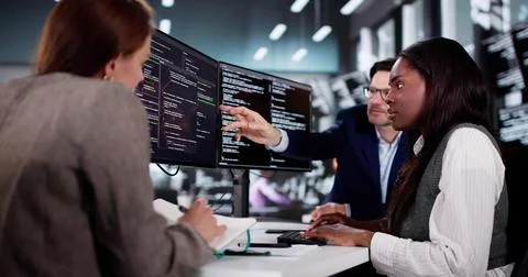 Innovative African Programmer Collaborating With Diverse Team In Cyber Office Stock Photos