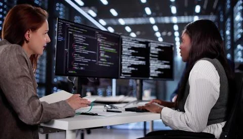 Innovative African Programmer Collaborating With Diverse Team On Software Dev Stock Photos
