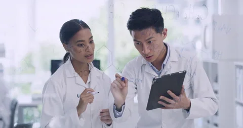 Innovative biochemists making medical breakthrough and scientific discovery in a Stock Footage