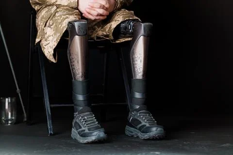 Innovative Bionic Leg Prosthesis in Military Attire Stock Photos