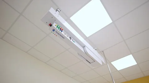 Innovative ceiling power console has safety emergency button Stock Footage 332719032