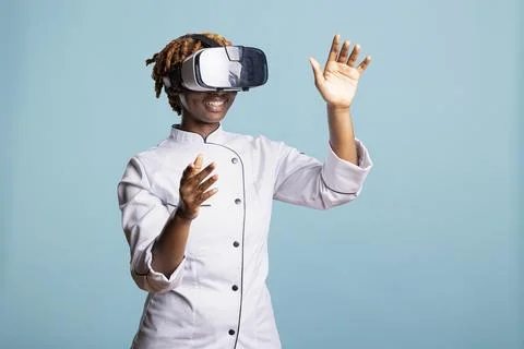 Innovative chef exploring virtual reality cooking environment Stock Photos