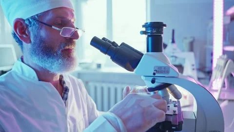 Innovative Chemist Analyzing Samples in Advanced Laboratory With Neon Lighting Stock Footage 281313596