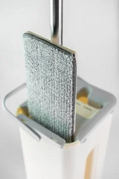Innovative cleaning tool features a removable microfiber pad in a sleek sto.. Foto stock