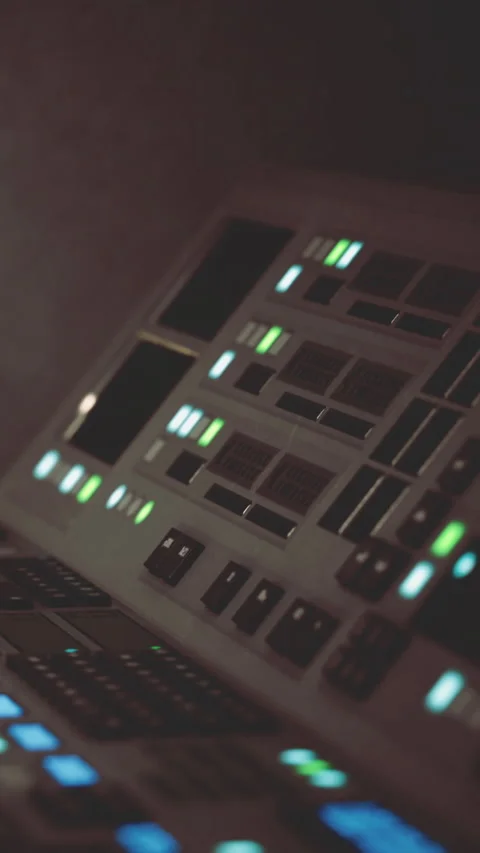 Innovative control panel with glowing lights in a modern studio setting Stock Footage 335097940