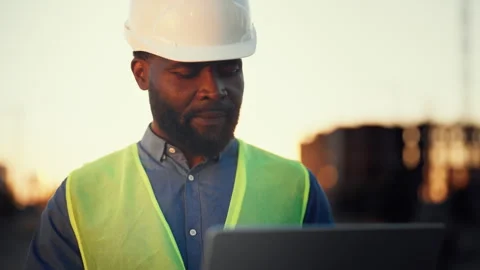 Innovative development technology, medium portrait of black foreman with laptop Stock Footage 318343698