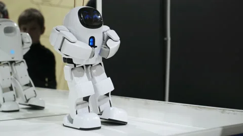 Innovative electronic robot is moving, dancing. White small futuristic robot Video stock 166521575