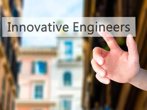 Innovative Engineers - Hand pressing a button on blurred background concept . Foto stock