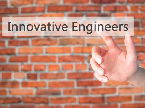 Innovative Engineers - Hand pressing a button on blurred background concept . Foto stock