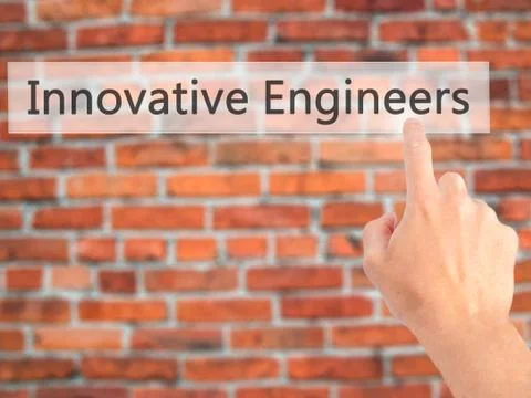 Innovative Engineers - Hand pressing a button on blurred background concept . Foto stock