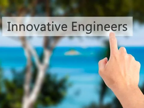 Innovative Engineers - Hand pressing a button on blurred background concept . Foto stock