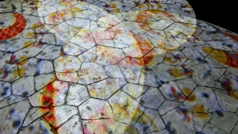 ​Innovative Gobo Projector Lighting on Stone Pavement Stock Footage 332923924