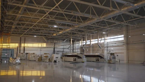 Innovative machine tools stored in future factory workshop Stock Footage 275150154