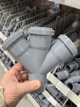 Innovative pipe fitting design showcased during a hardware shopping excursion Stock Photos
