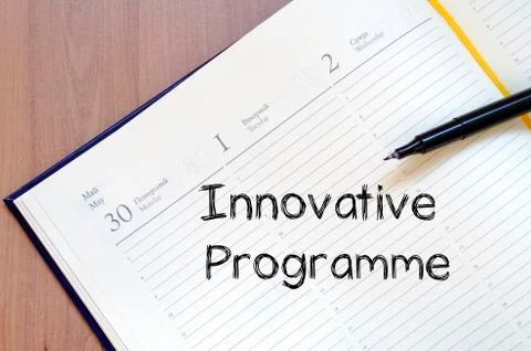 Innovative programme write on notebook Stock Photos