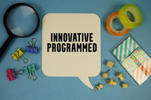 Innovative Programmed text with stationery on blue background Foto stock