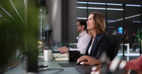 Innovative Programmers Collaborating on Diverse Software Solutions Stock Photos