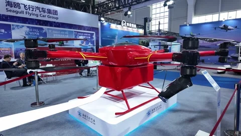 Innovative Red Drone Displayed at Technology Expo Showcasing Future Mobility 스톡 동영상 324845504