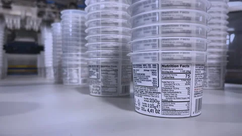 Innovative Robotics for Streamlined PP Cup Stacking on Conveyor Stock Footage 292639261