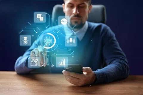 Innovative technology concept with man using smartphone and holographic display Stock Photos