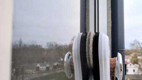 Innovative window cleaning device with dual rotating brushes Stock Photos