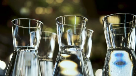 Input in decanters. drinking water in a beautiful decanter. restaurant interior. Stock Footage 193527056