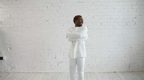 An insane black man in his forties wearing a straitjacket dance and try to get Video stock 59089211