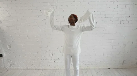 An insane black man in his forties wearing a straitjacket dance and have fun Video stock 59089490
