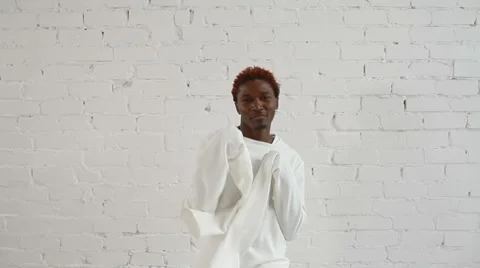An insane black man in his forties wearing a straitjacket dance and have fun 스톡 동영상 59089677